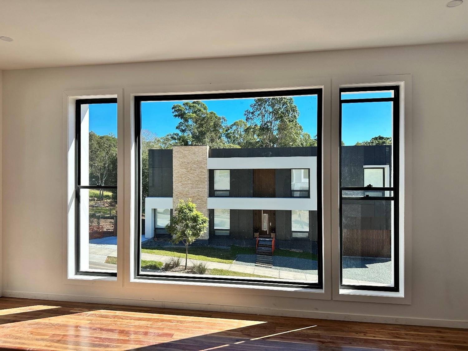 A fixed centre pane flanked by opening sashes across a living room wall