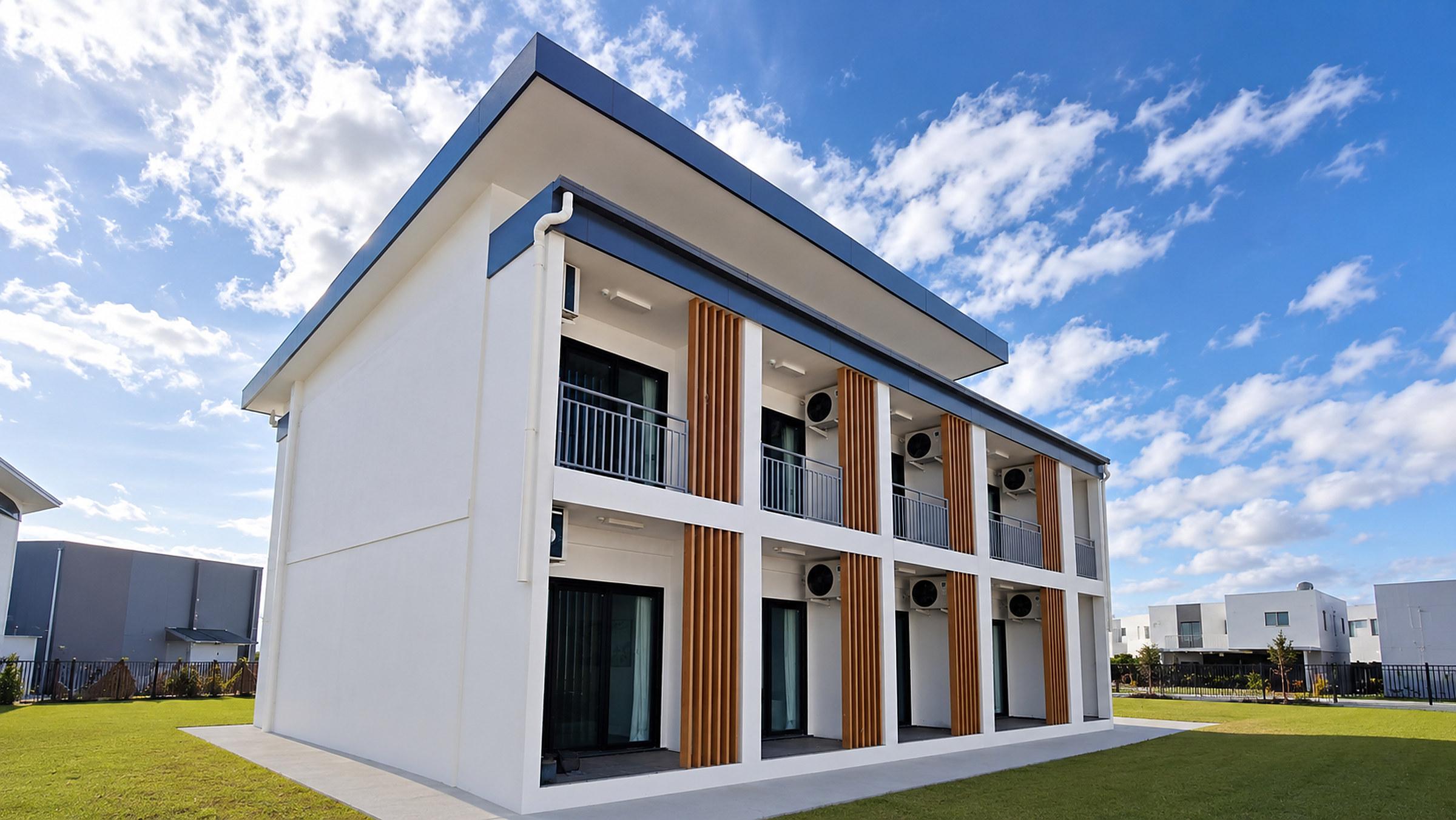 Two-storey townhouse development with sliding doors to each terrace