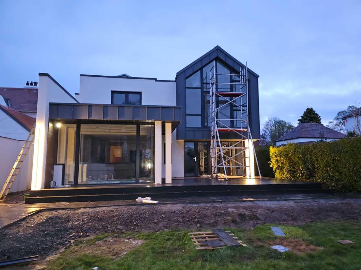 British Villa living space with minimalist glazing